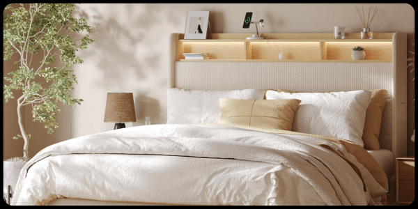 A bed with a headboard and a lamp