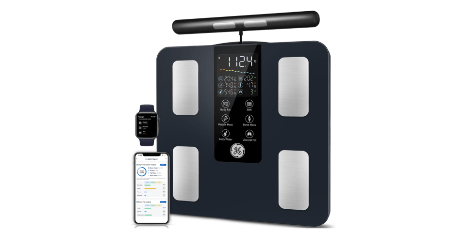 A digital scale with a smart watch and a smartwatch