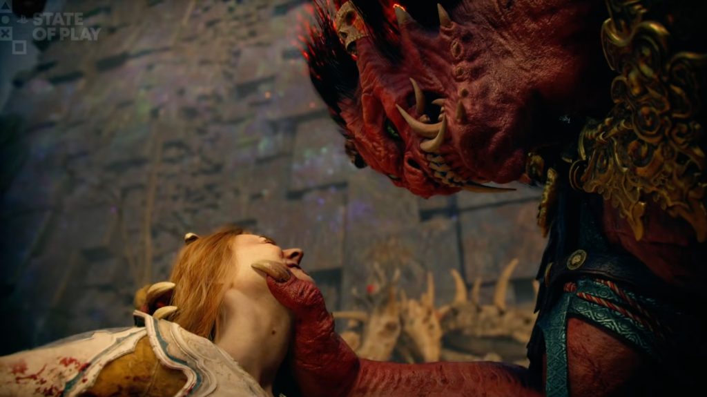 A woman with a red dragon's hand touching a woman's face