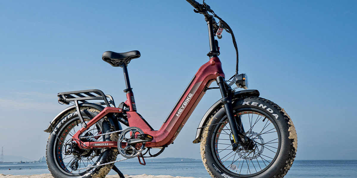 A red bike on a beach