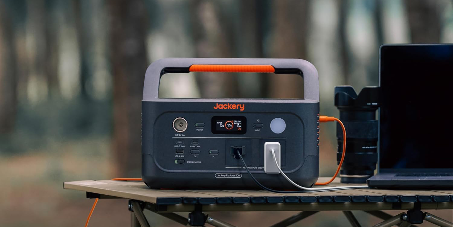 A black and orange portable radio
