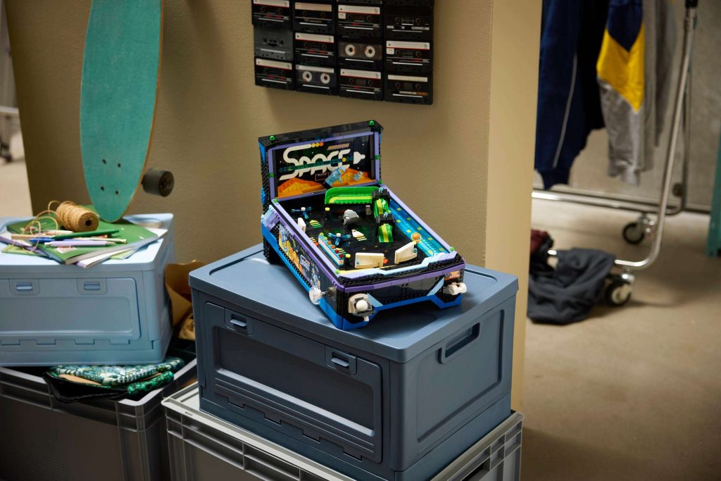 A pinball machine on top of plastic crates