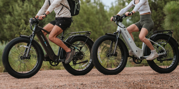 A couple of people riding bikes