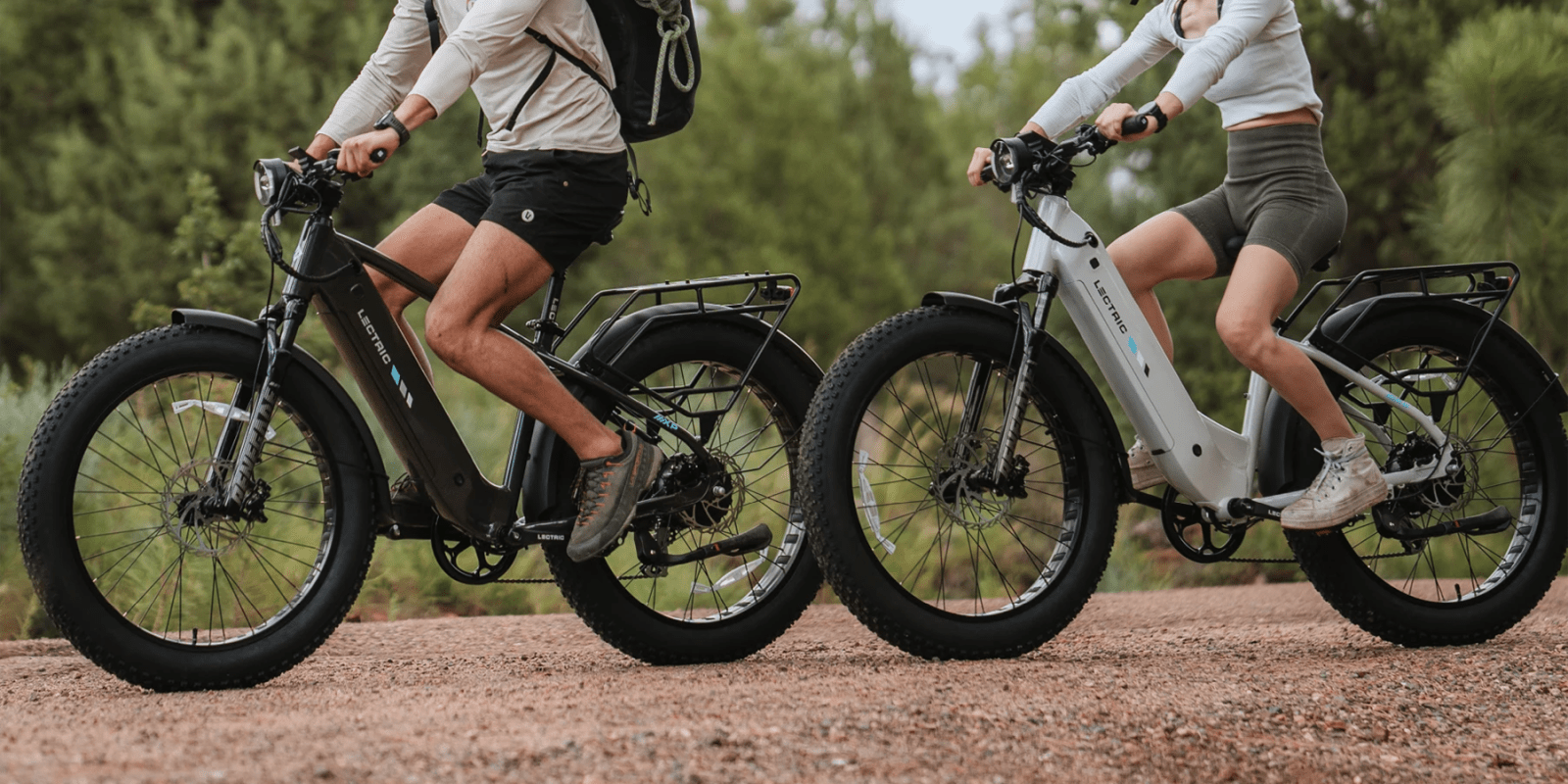 A couple of people riding bikes