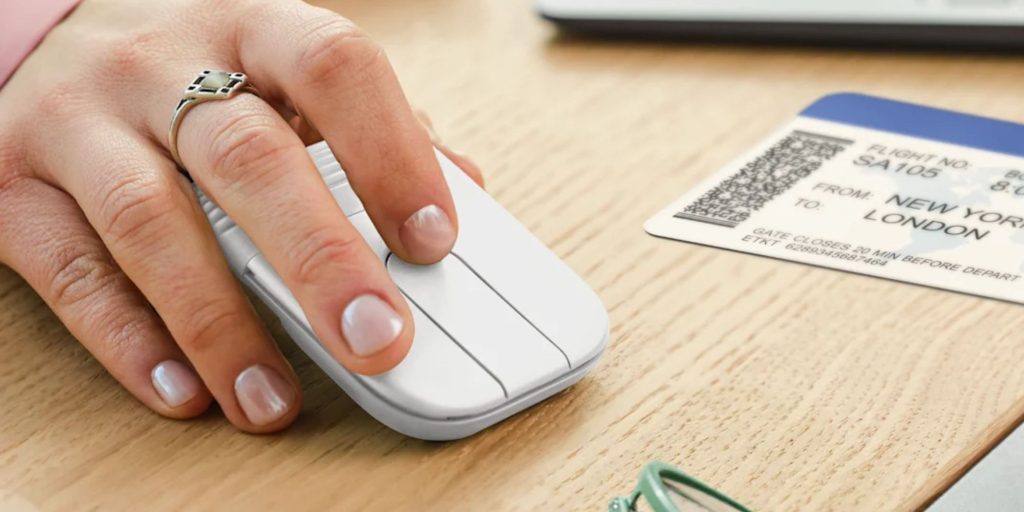 A hand holding a mouse