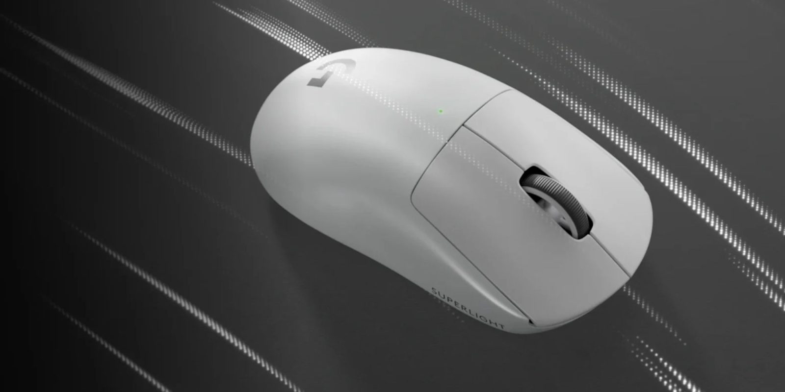 A white computer mouse on a black surface