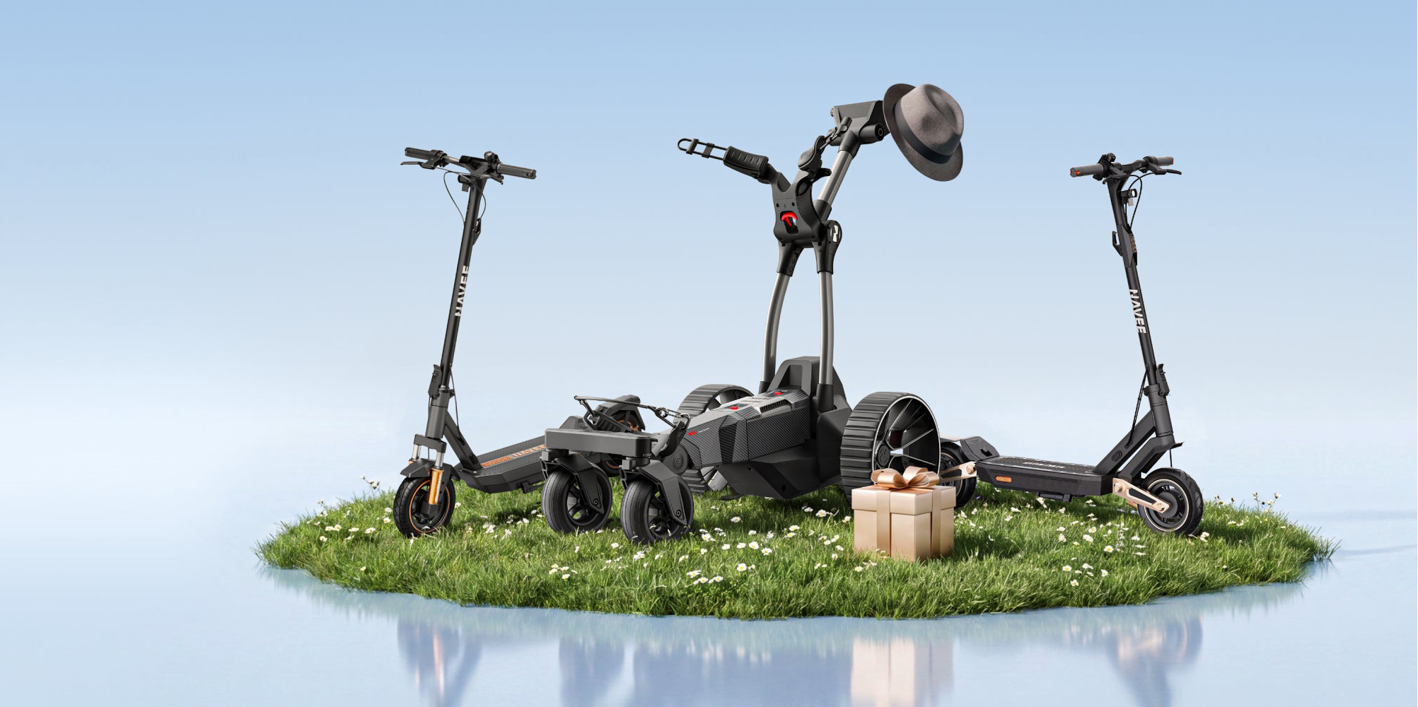 A black electric scooter on grass with a gift box