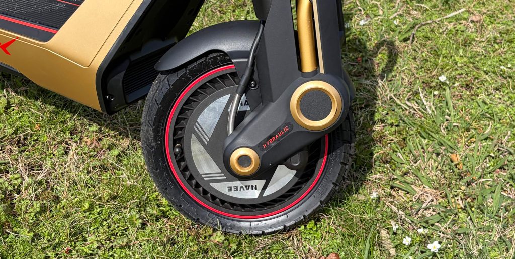 A black and gold wheel on grass