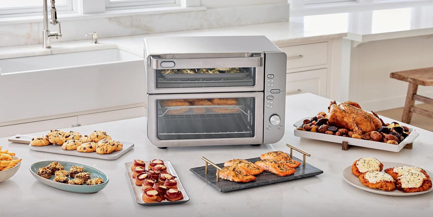 A toaster oven with food on a counter
