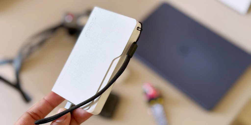 Image showing a person holding ORICO's iFolder Go SSD.