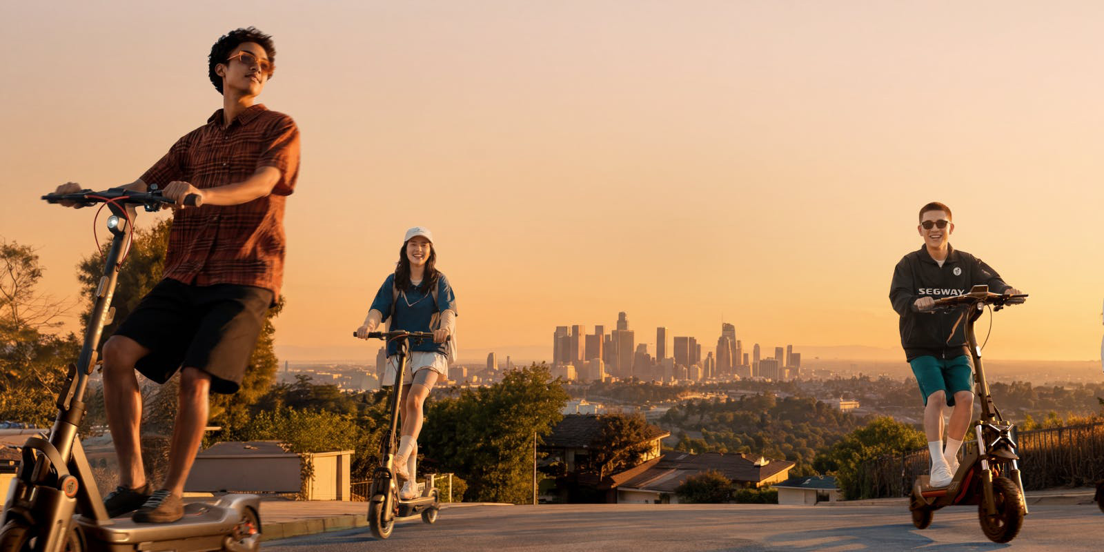 A man and woman riding a scooter