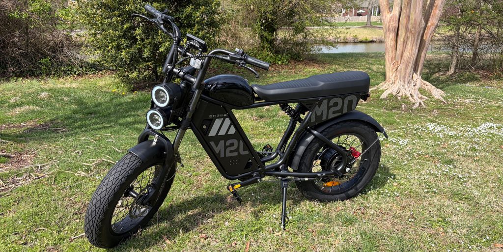 A black motorcycle parked on grass
