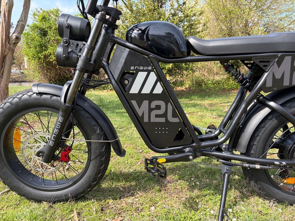 A black motorcycle parked on grass