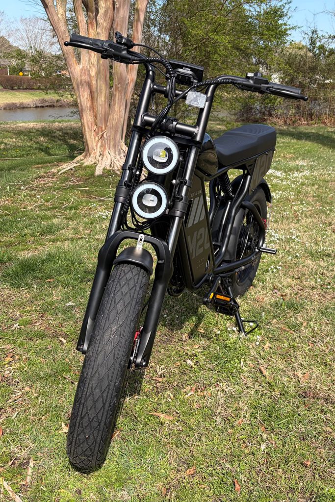 A black motorcycle parked on grass