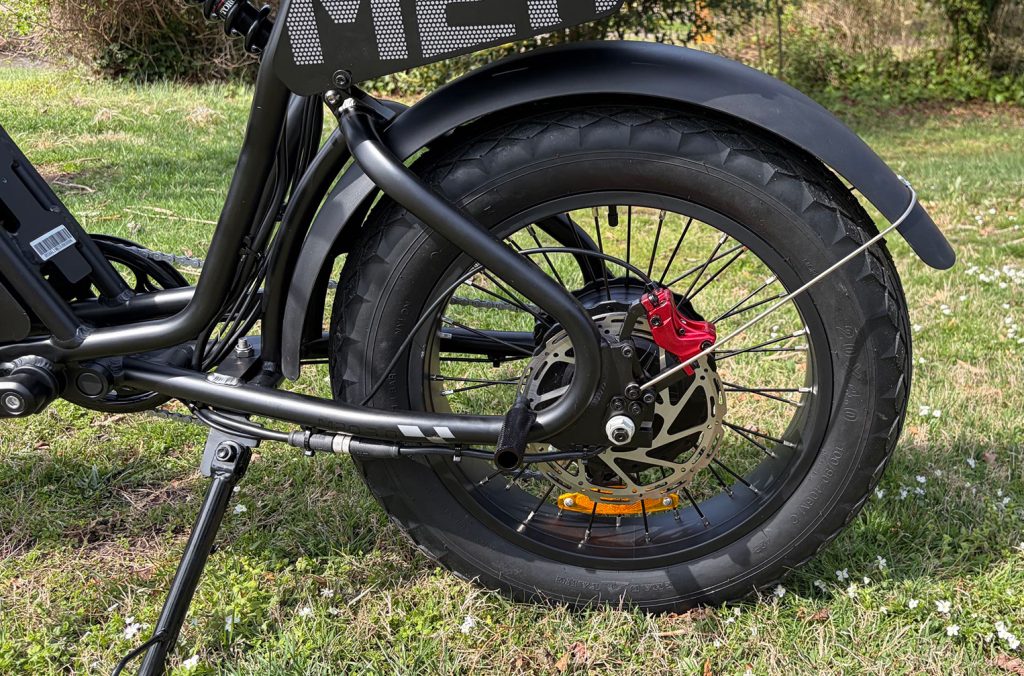 A close up of a black wheel