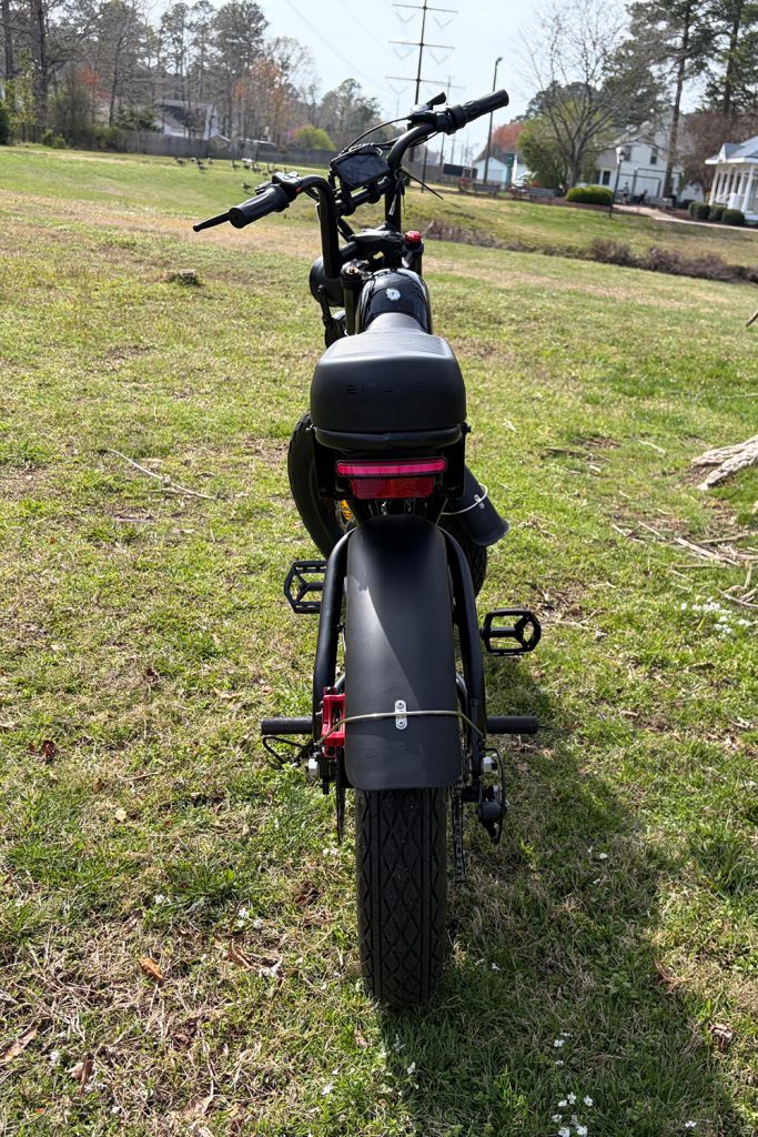 A black motorcycle parked on grass