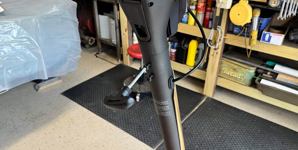 A black and brown object with a black handle