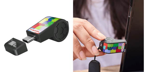 A hand holding a whistle