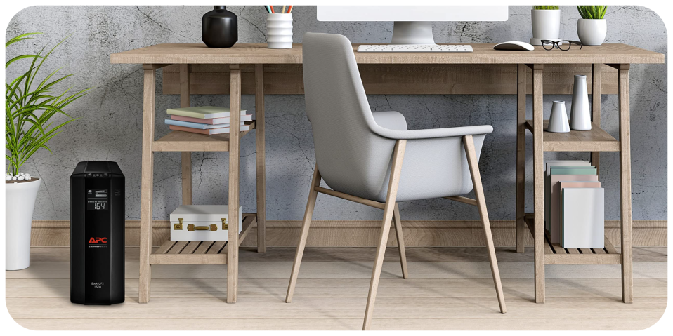 A chair and desk with a computer