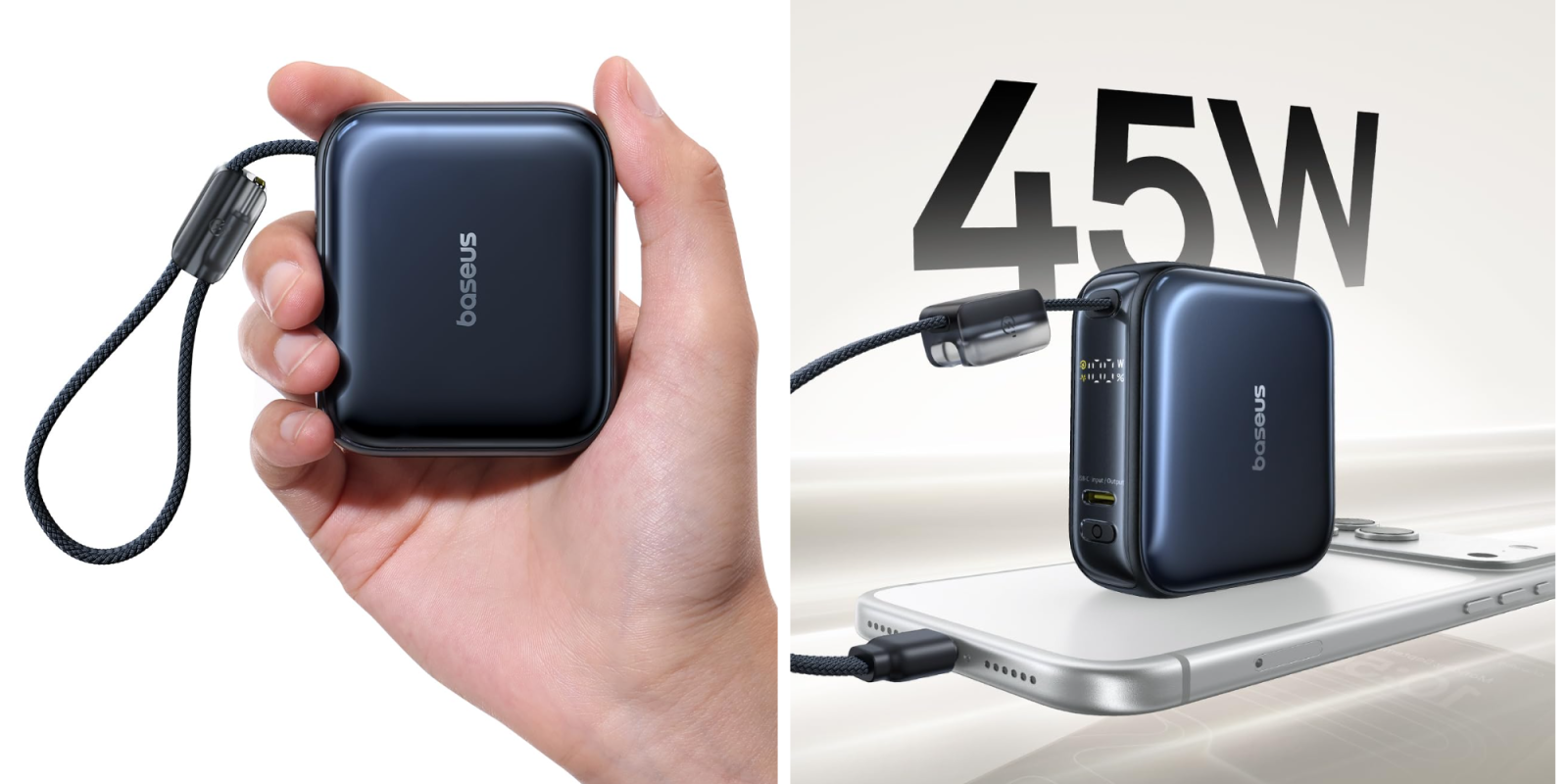 A hand holding a black square device