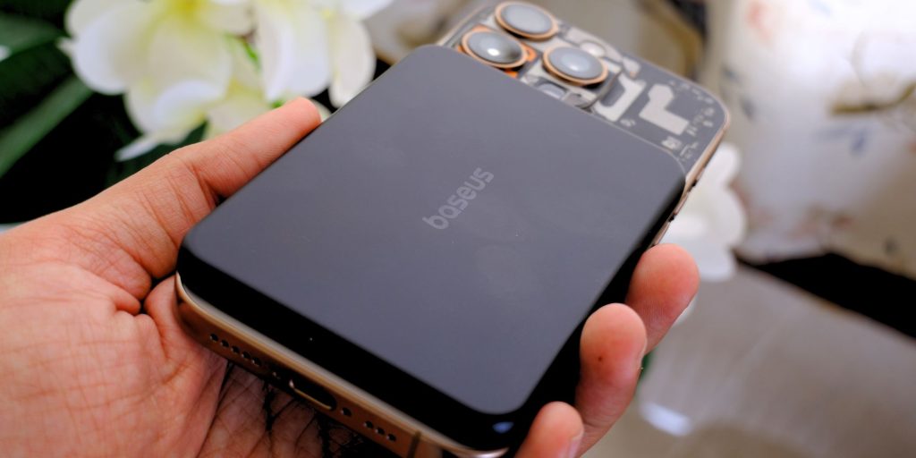 A hand holding a device
