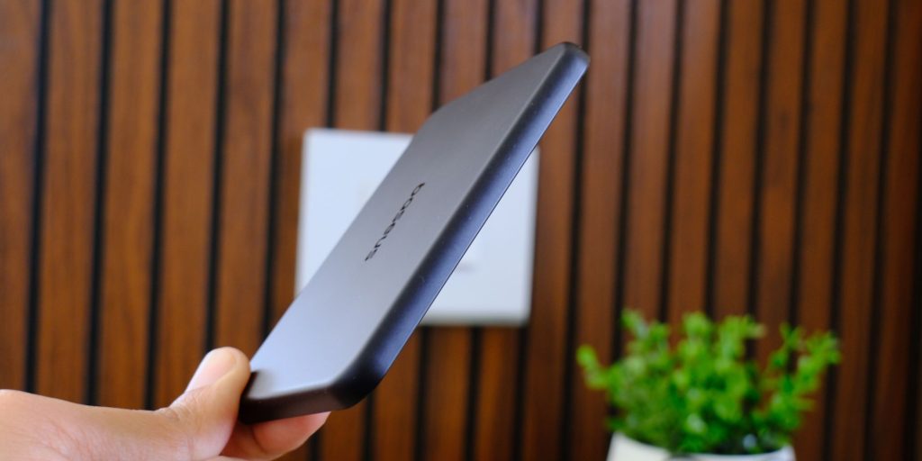 A hand holding a rectangular device