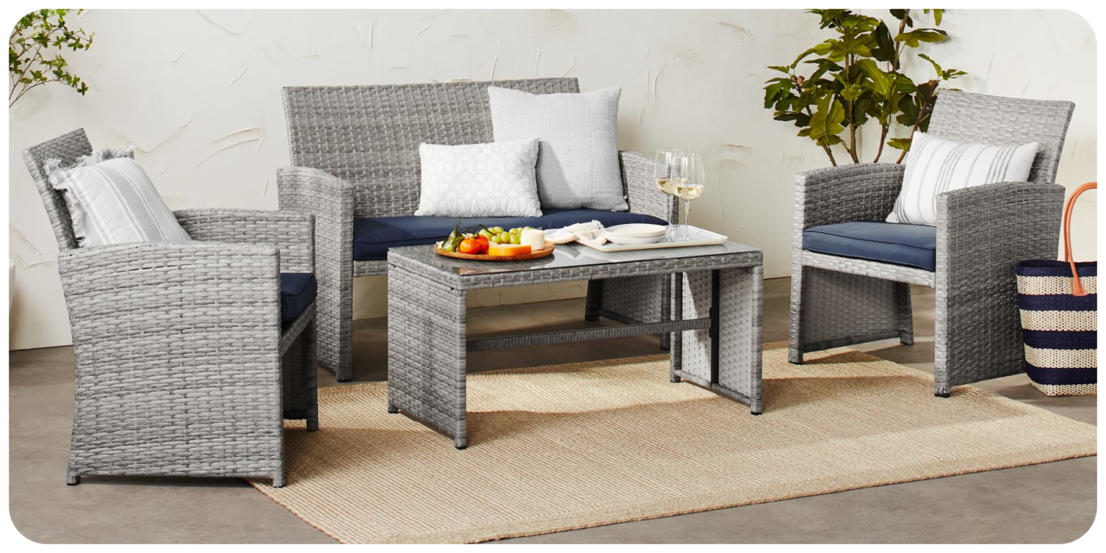 A patio furniture with a table and chairs