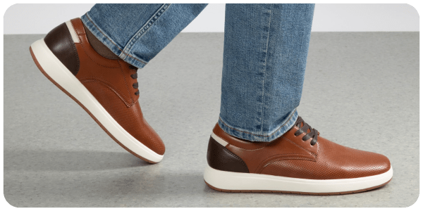A person's legs and shoes