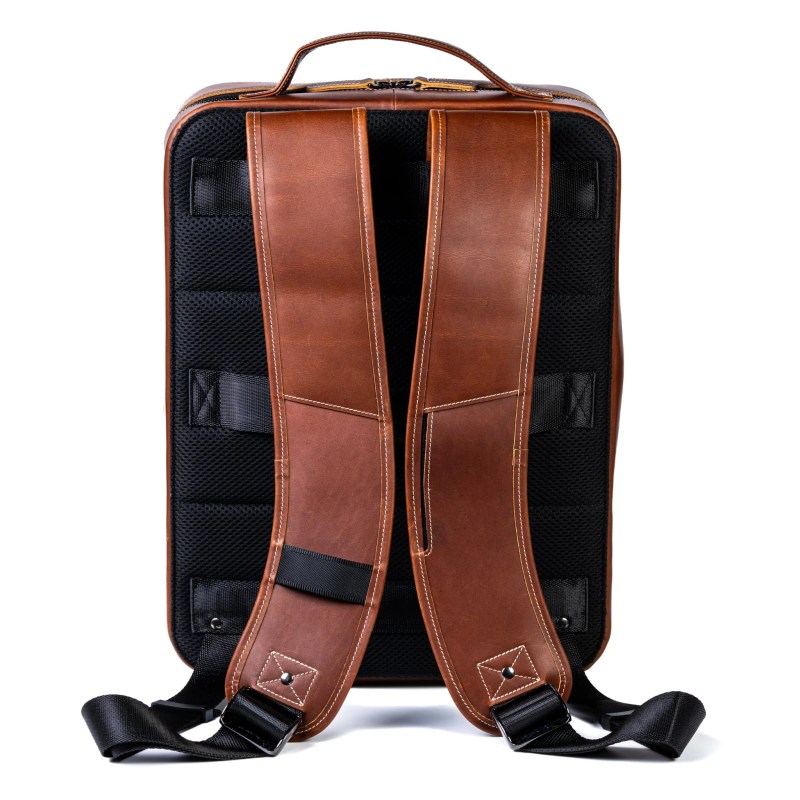 A brown leather bag with straps