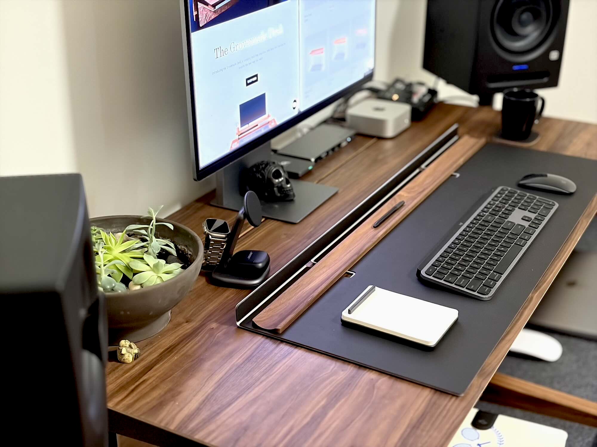 A desk with a computer and a keyboard
