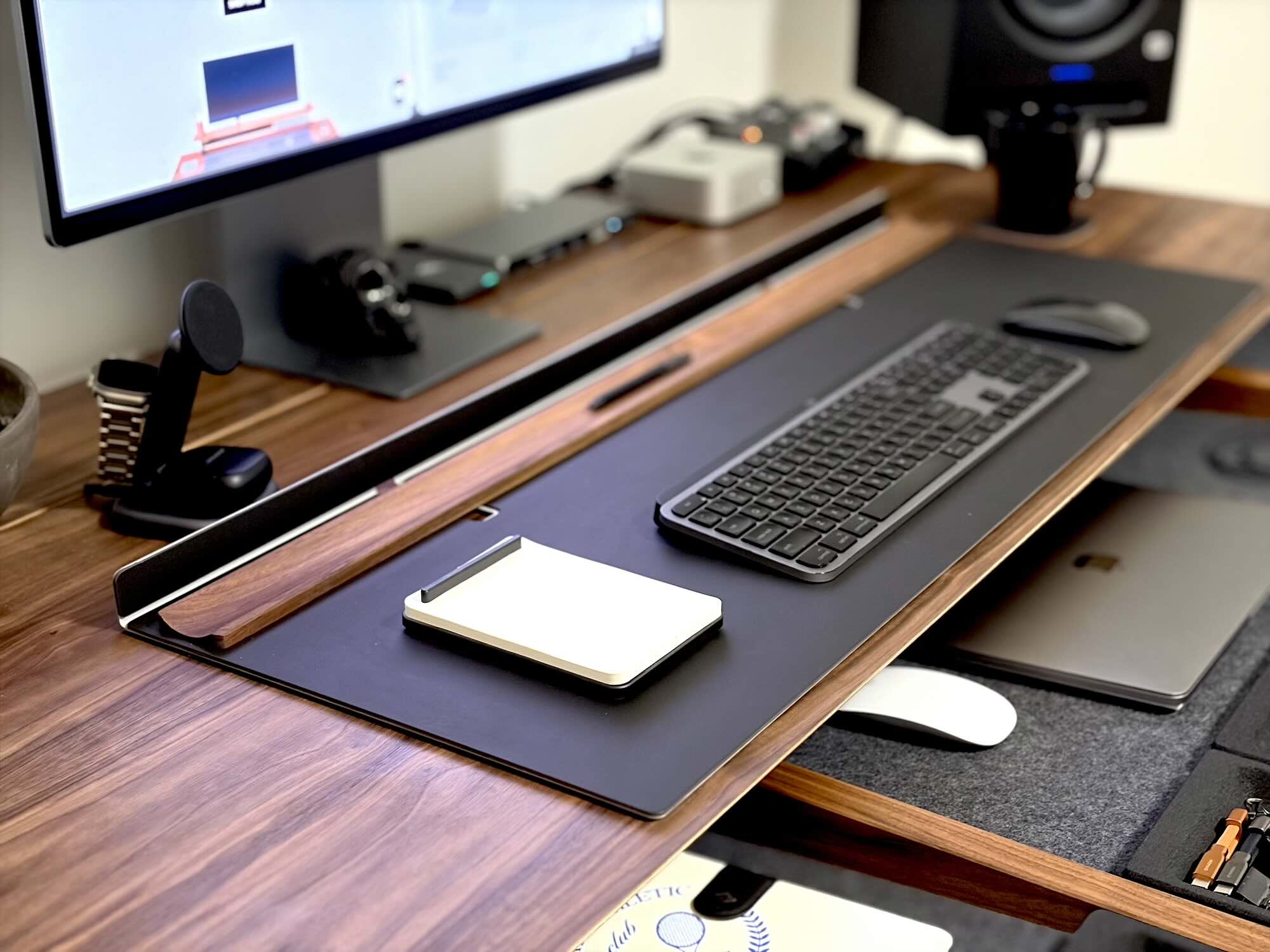 A desk with a computer and a keyboard