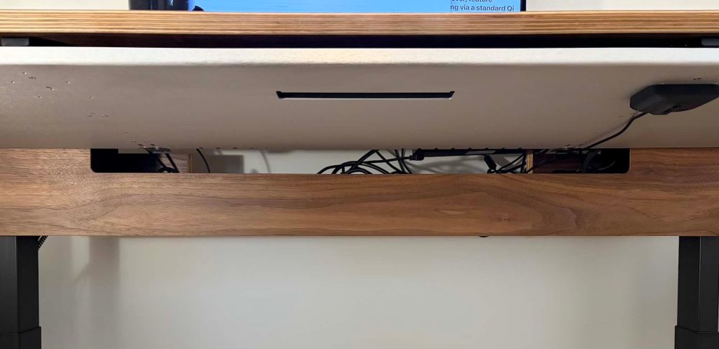 A desk with a computer on it