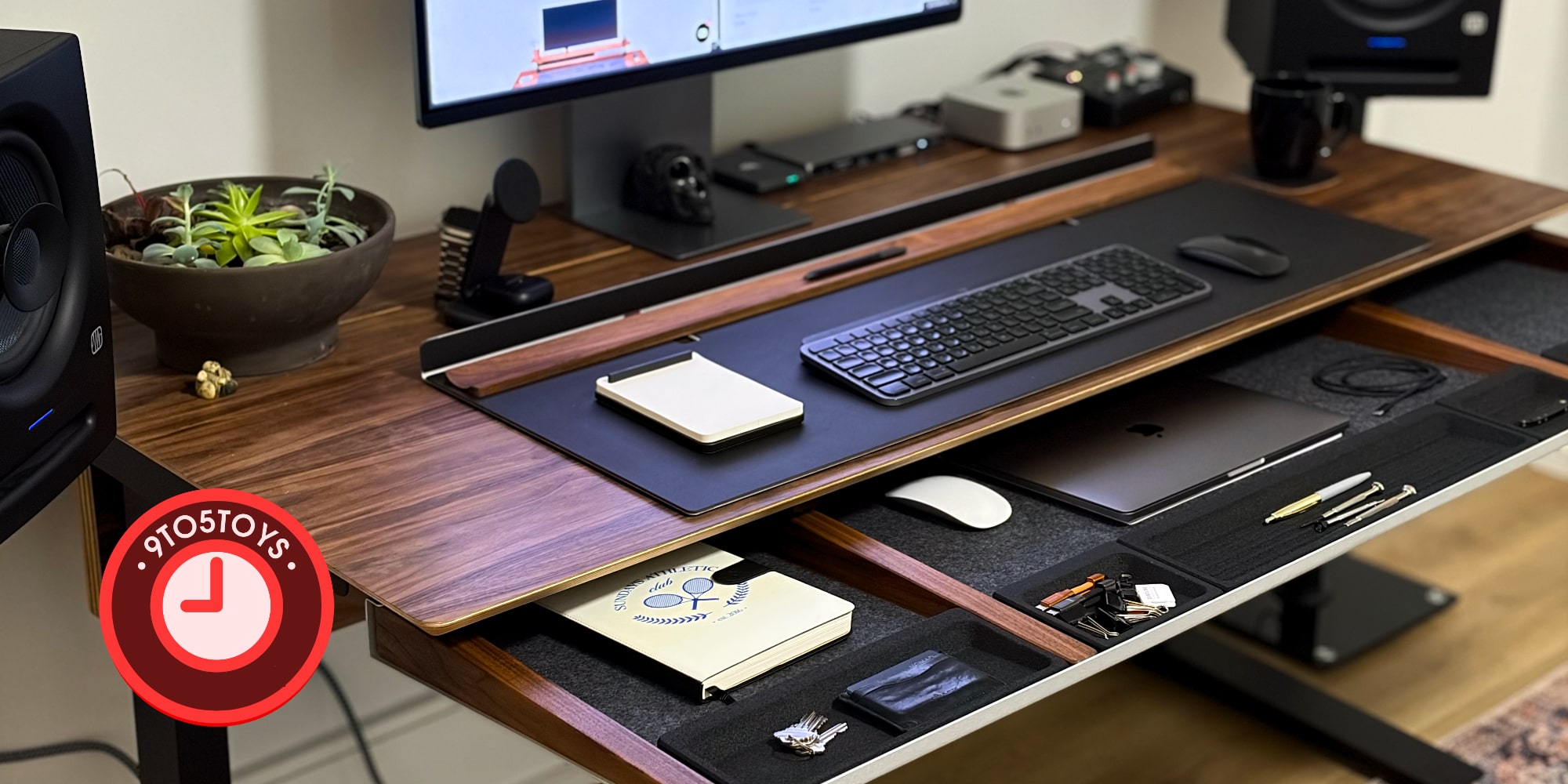 A desk with a computer and a keyboard