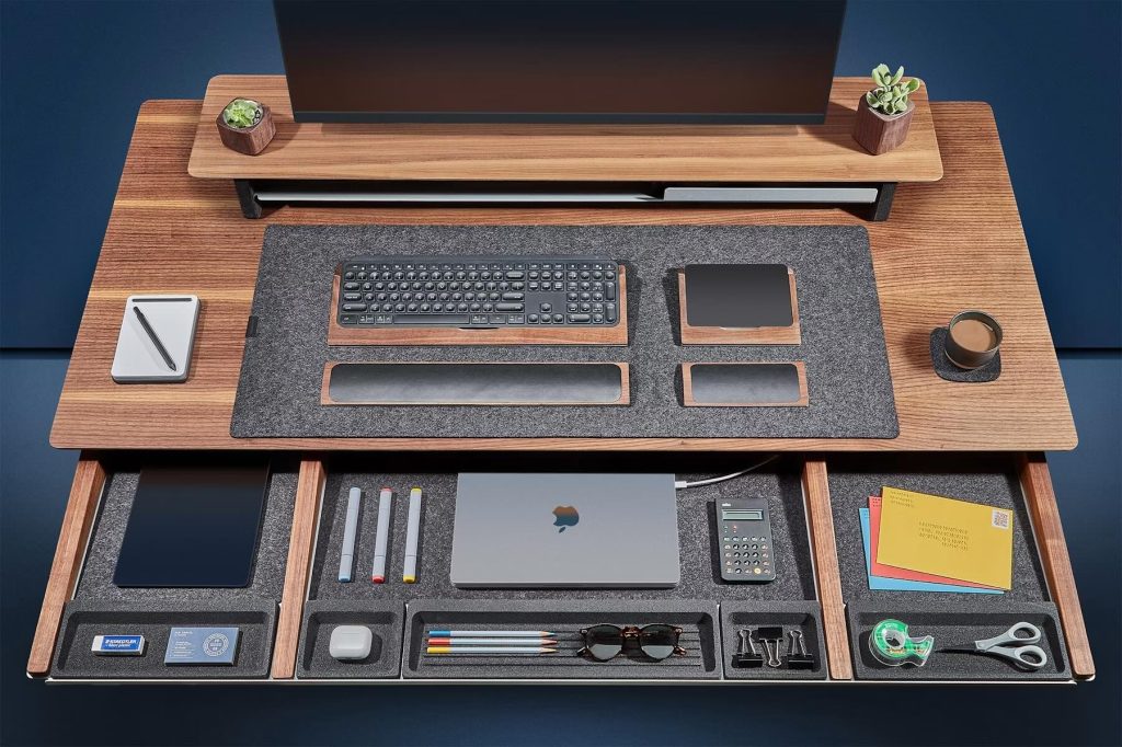 A desk with a computer and a keyboard