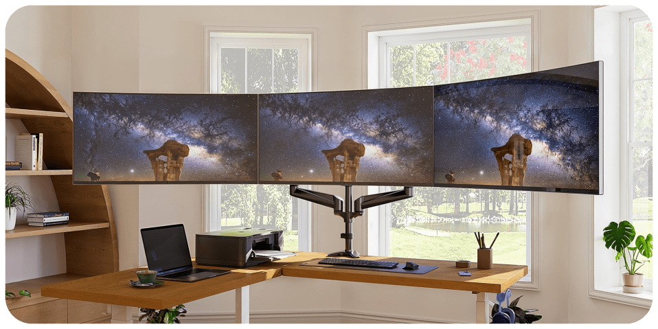 A desk with multiple screens
