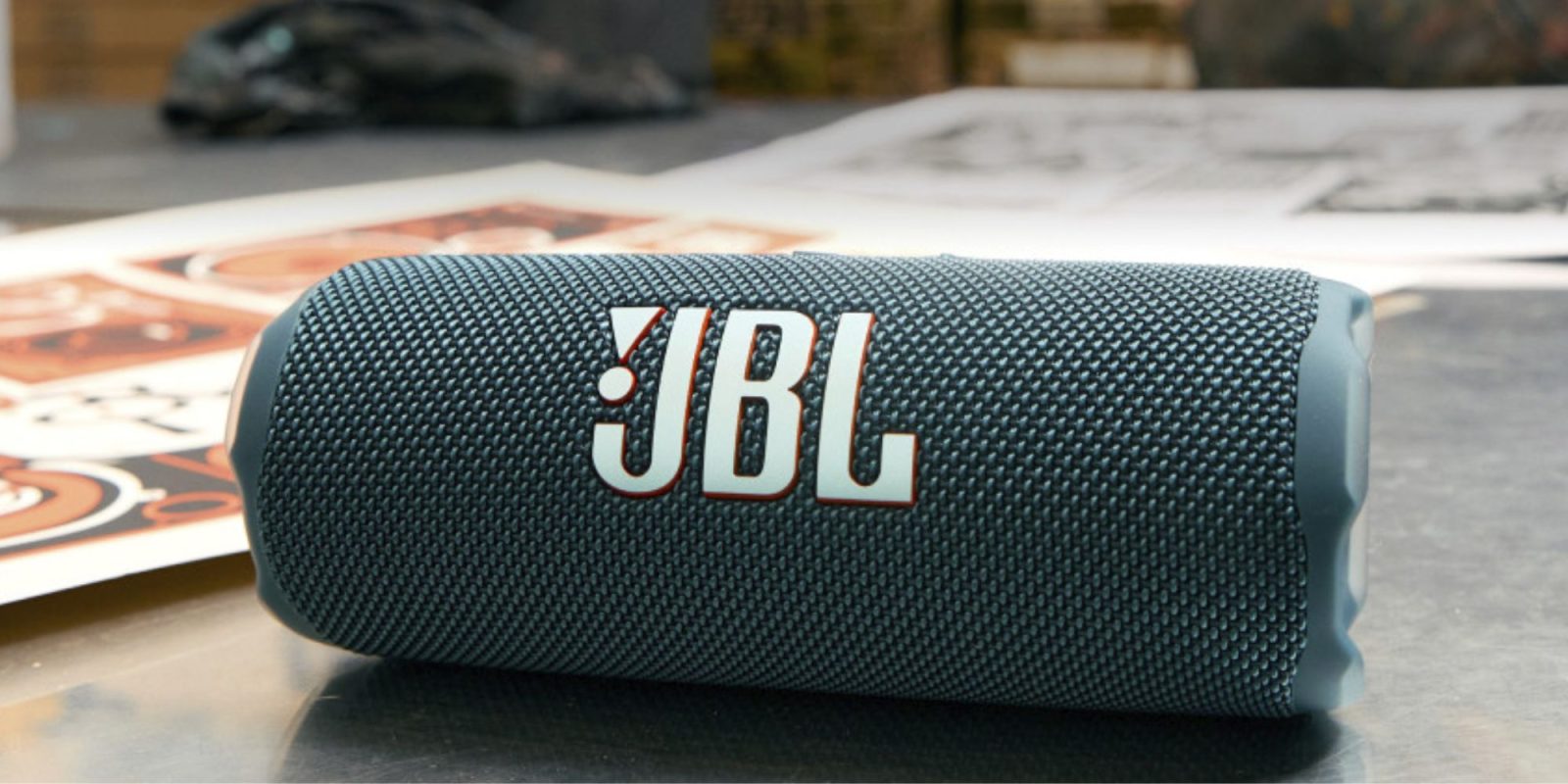 A speaker with a logo on it