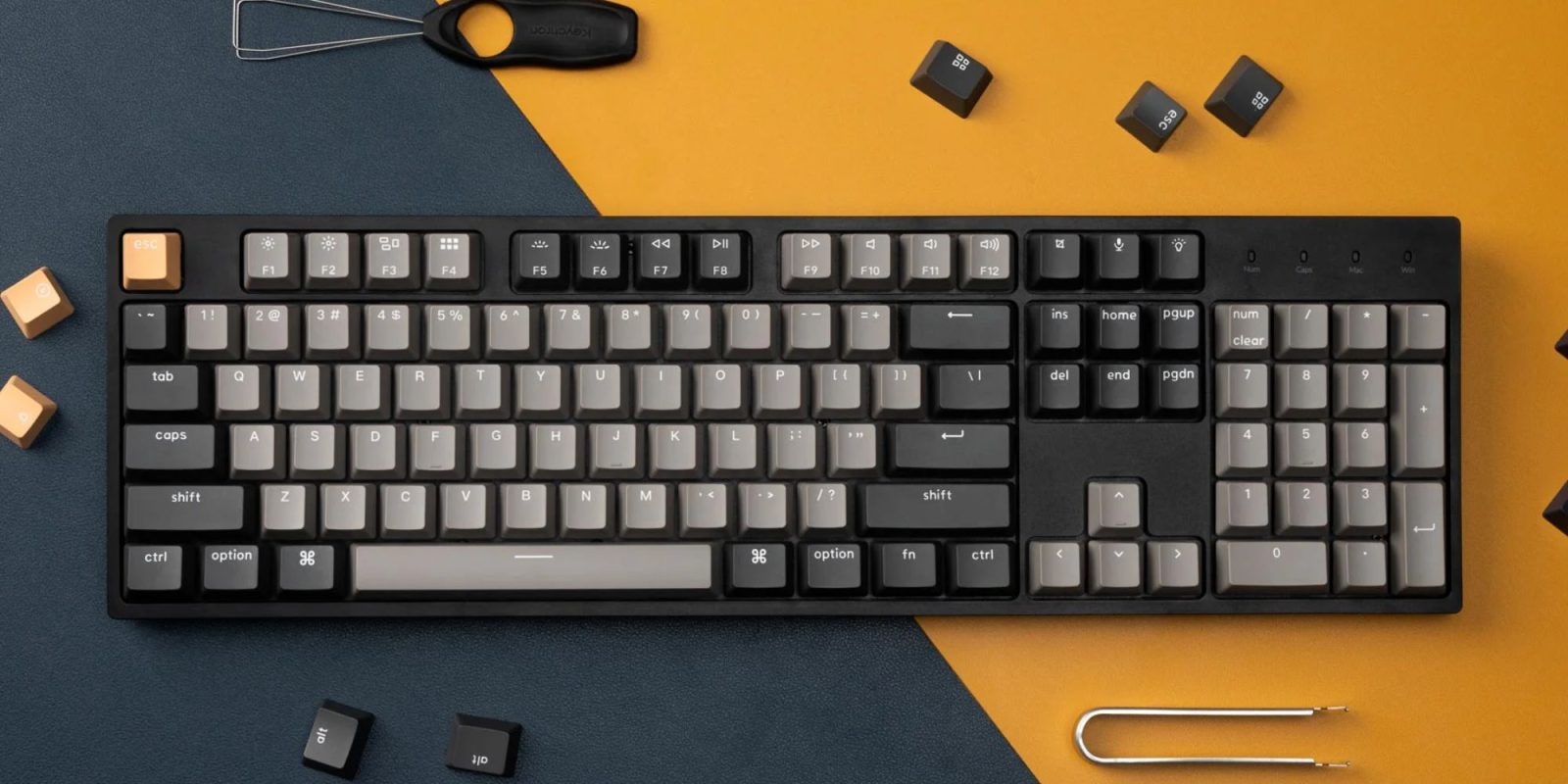 A keyboard and scissors on a table