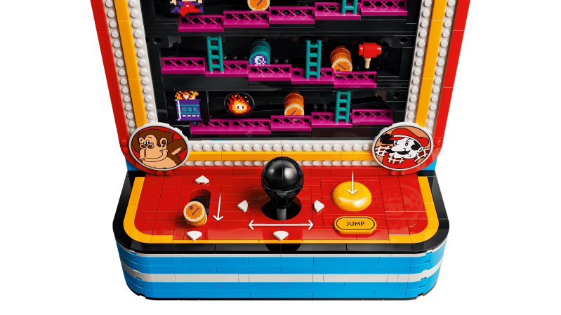 A toy arcade game with a stick and buttons