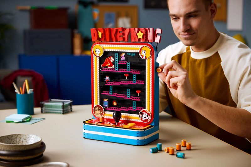 A man playing with a toy machine