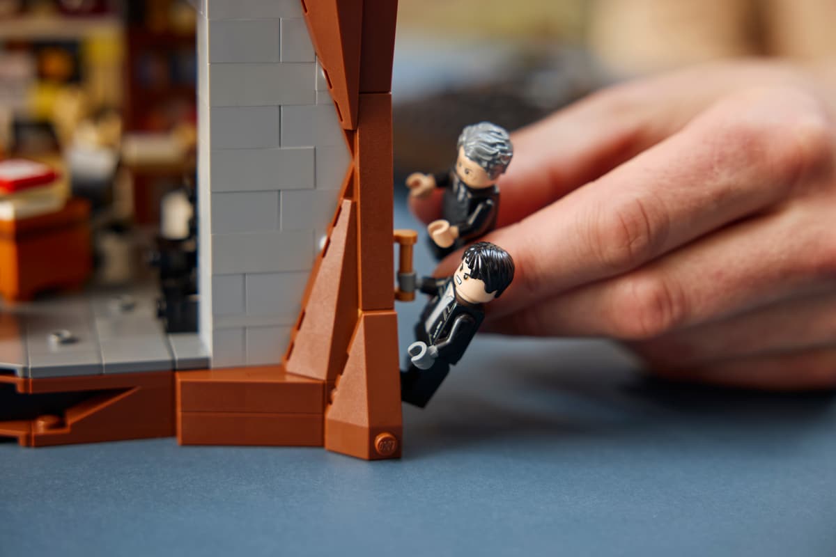 A hand holding a toy figurine