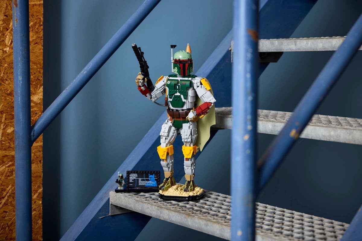 A toy figure on a metal ladder
