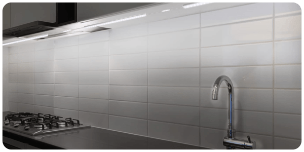 A kitchen with a sink and faucet