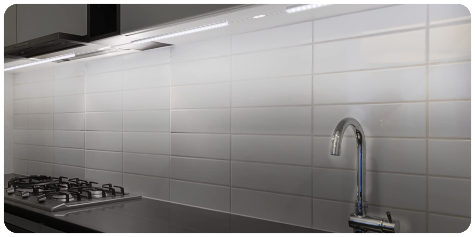 A kitchen with a sink and faucet