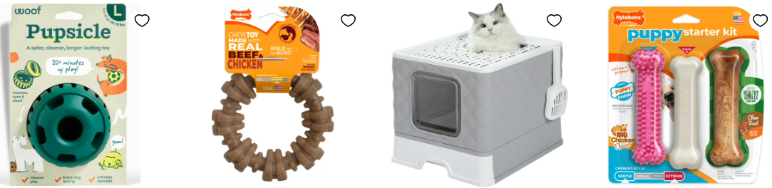 A cat lying on a box next to a cat toy