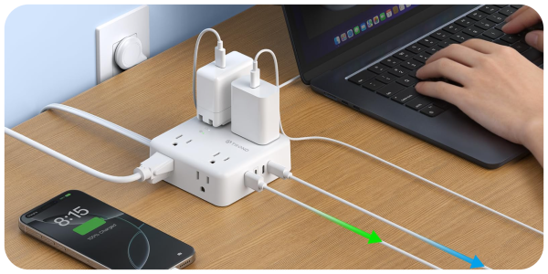 A white power strip with multiple plugs connected to a laptop