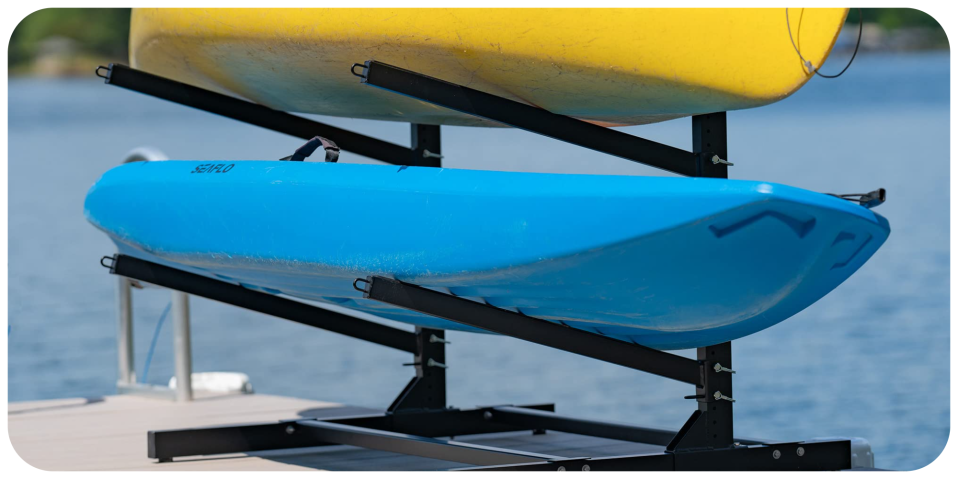 A blue and yellow kayaks on a rack