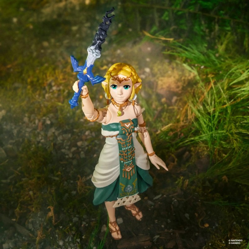 A toy figurine of a woman holding a sword