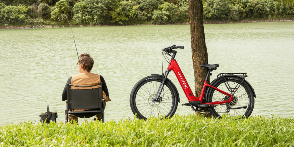 A man sitting in a chair next to a bicycle