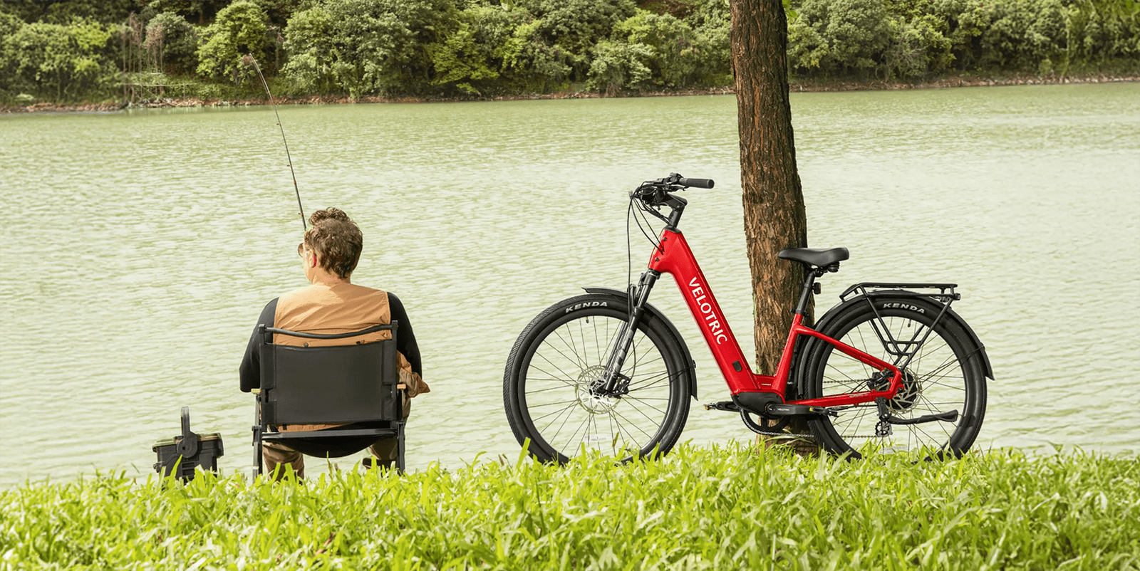 A man sitting in a chair next to a bicycle