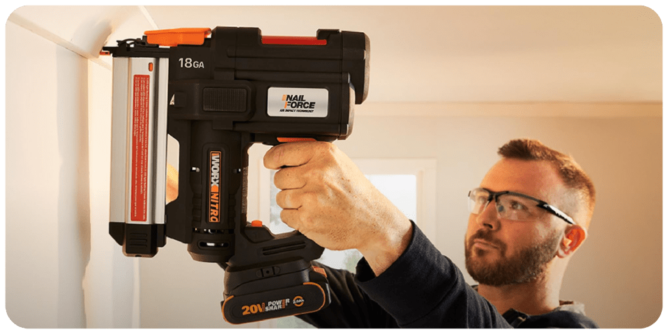 A man holding a power drill